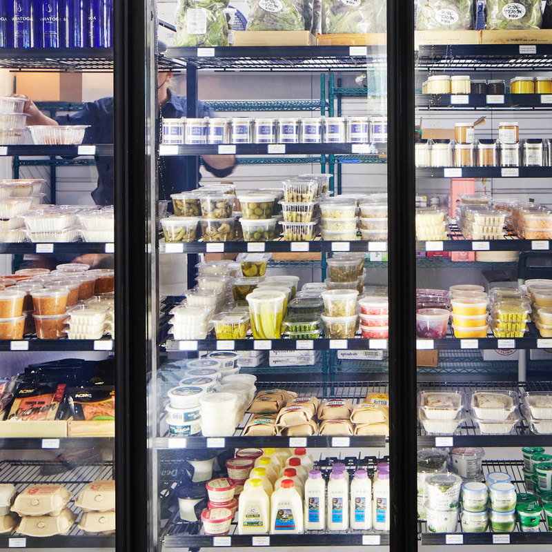 Our grab and go refrigerator, full of prepared foods.