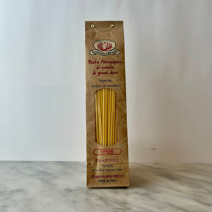 Package of Italian linguine pasta on a counter.
