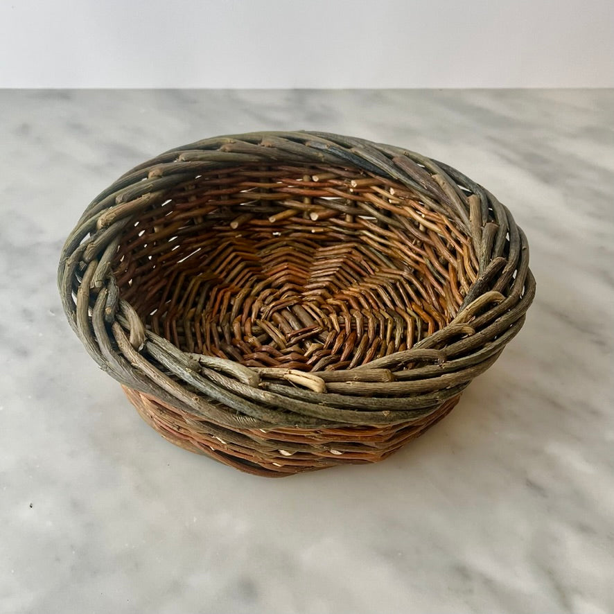 Woven basket on a marble surface.
