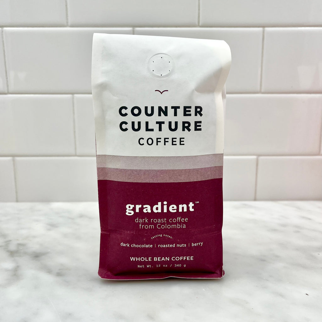 Package of Counter Culture whole bean coffee on a counter.