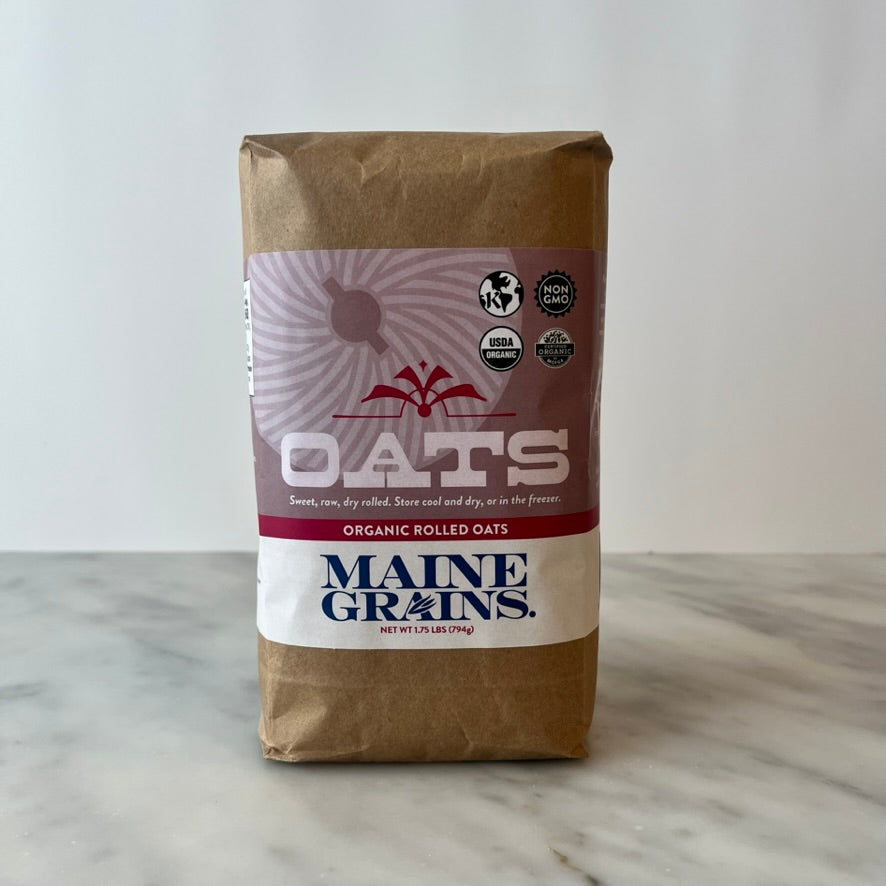 A bag of organic rolled oats on a table.