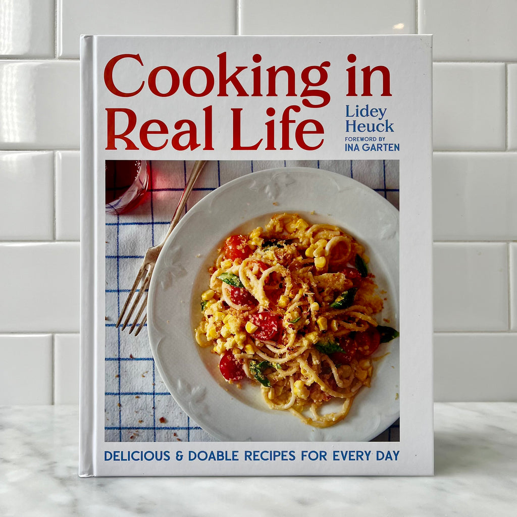Cookbook cover featuring a pasta dish.