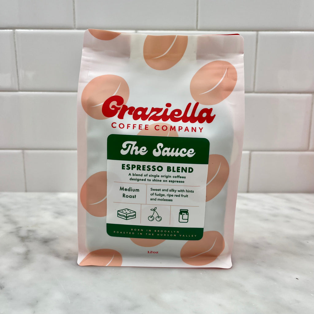A bag of Grazziella Coffee Company Espresso Blend on a tiled counter.