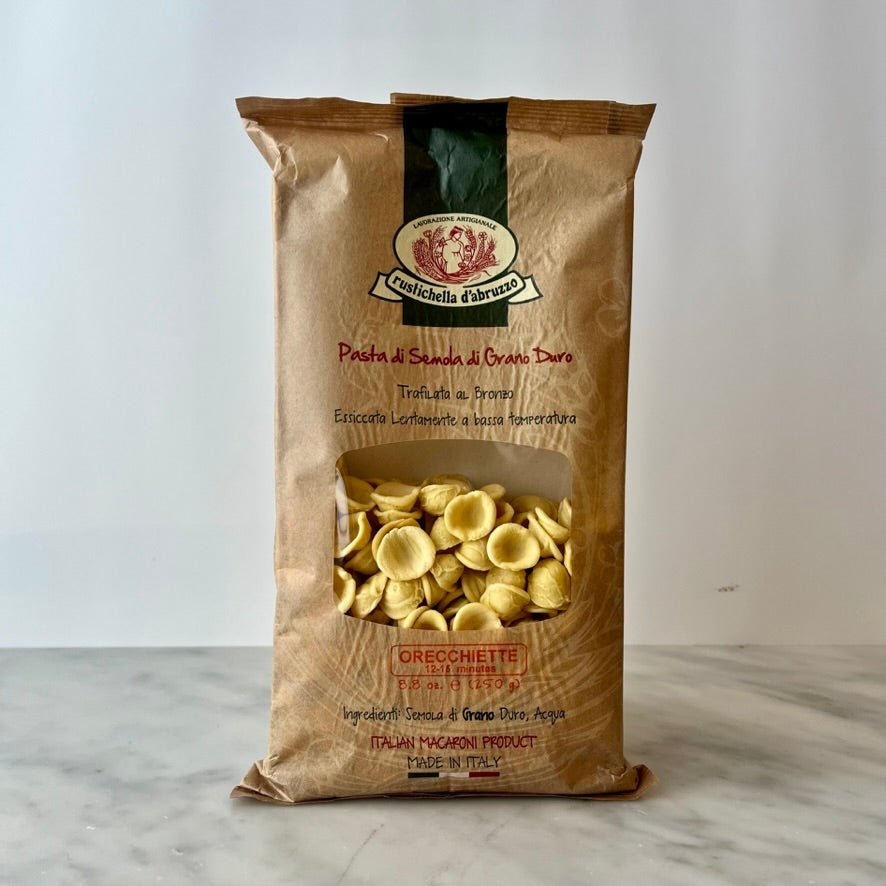 Bag of orecchiette pasta on a table.