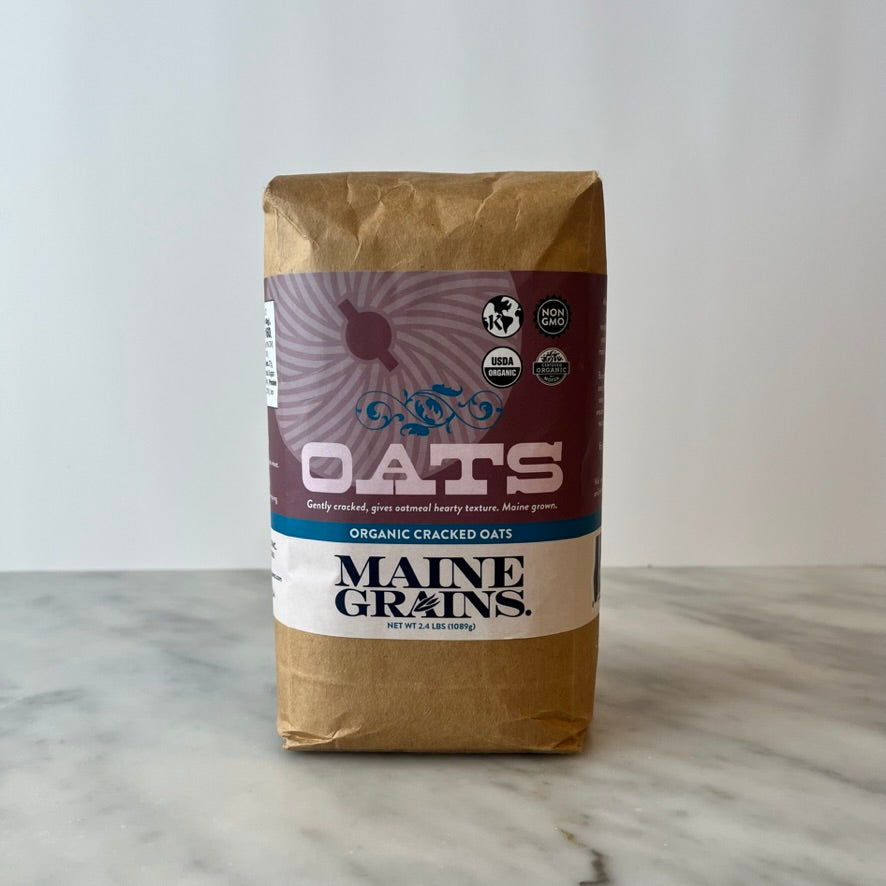 Package of organic cracked oats on a counter.