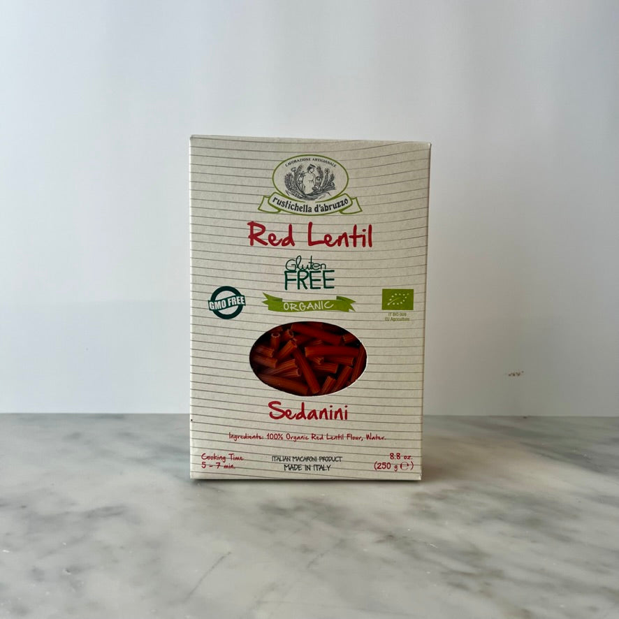 Package of red lentil pasta on a counter.