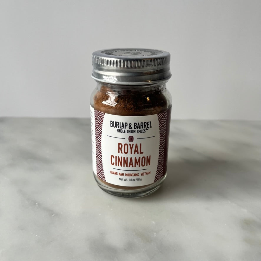 Jar of cinnamon on a table.