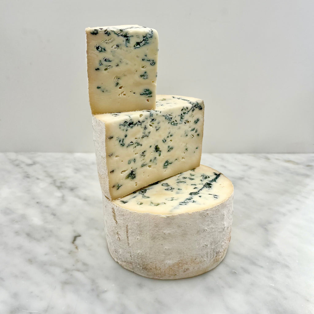 Blue cheese on a marble surface.