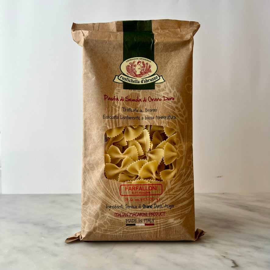 A bag of farfalle pasta on a table.