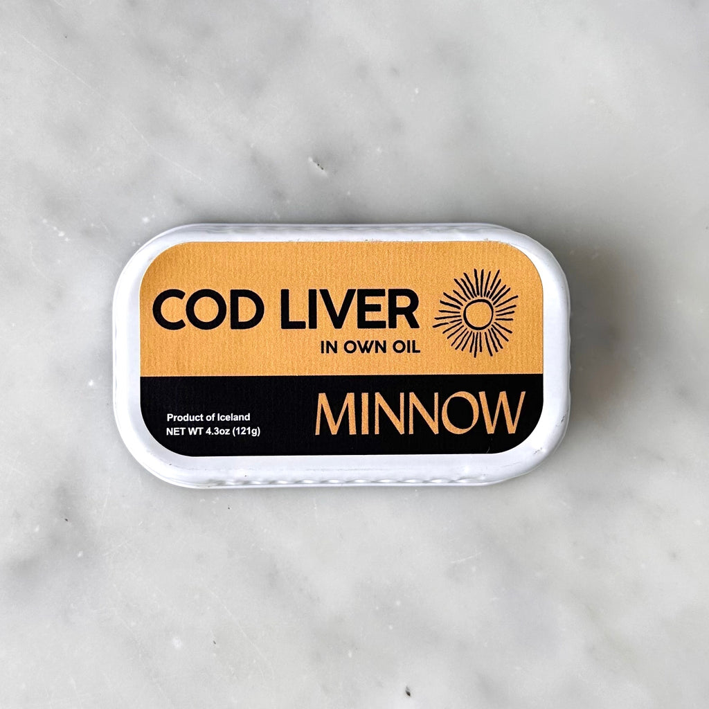 Can of cod liver oil on a marble surface.
